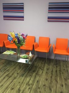 Front lobby contains chairs and reading materials for any waiting party.